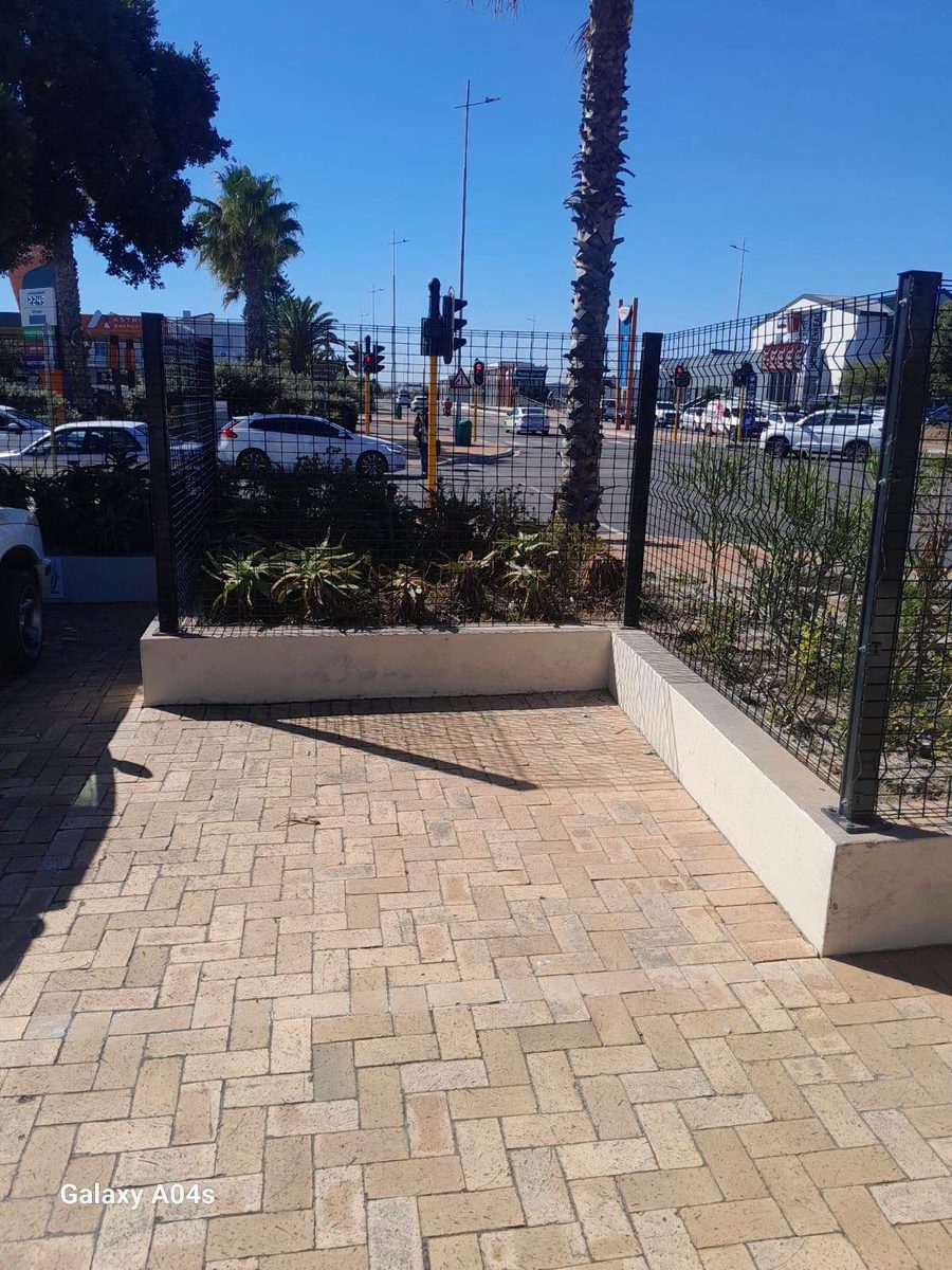 Paved walkway and perimeter fence installation