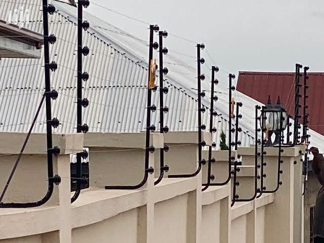 Electric fence brackets and wall-top security installation