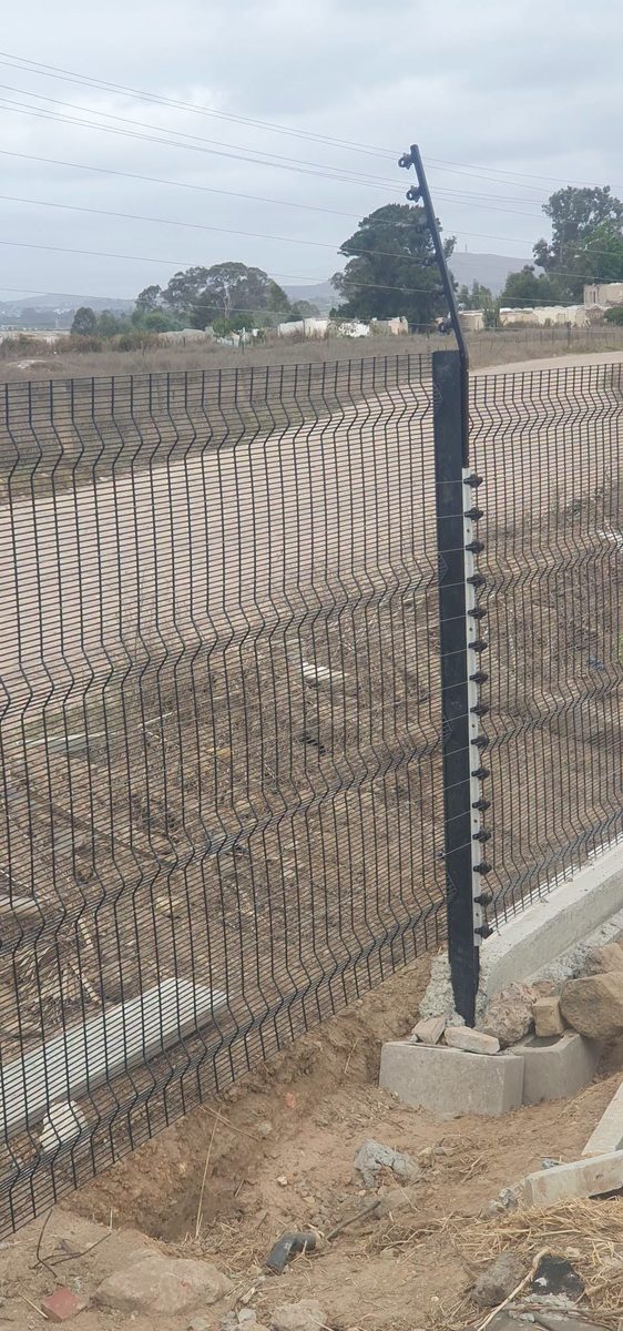 Tall perimeter fence and electric fence posts