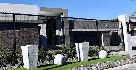 Modern home frontage with perimeter fencing